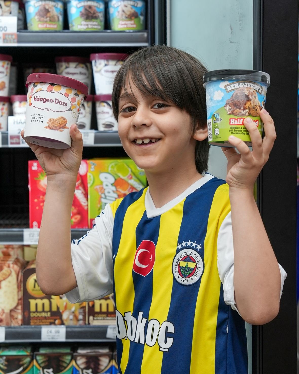 A young customer with ice cream from the freezer