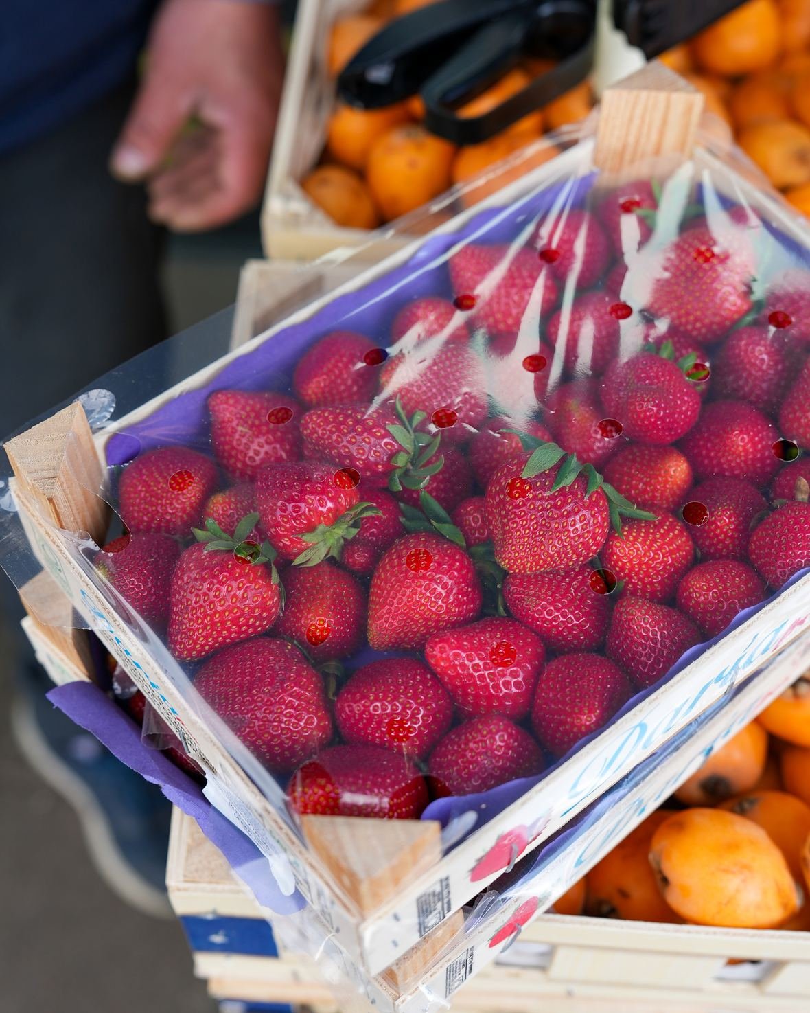 A punnet of strawberries on the produce table